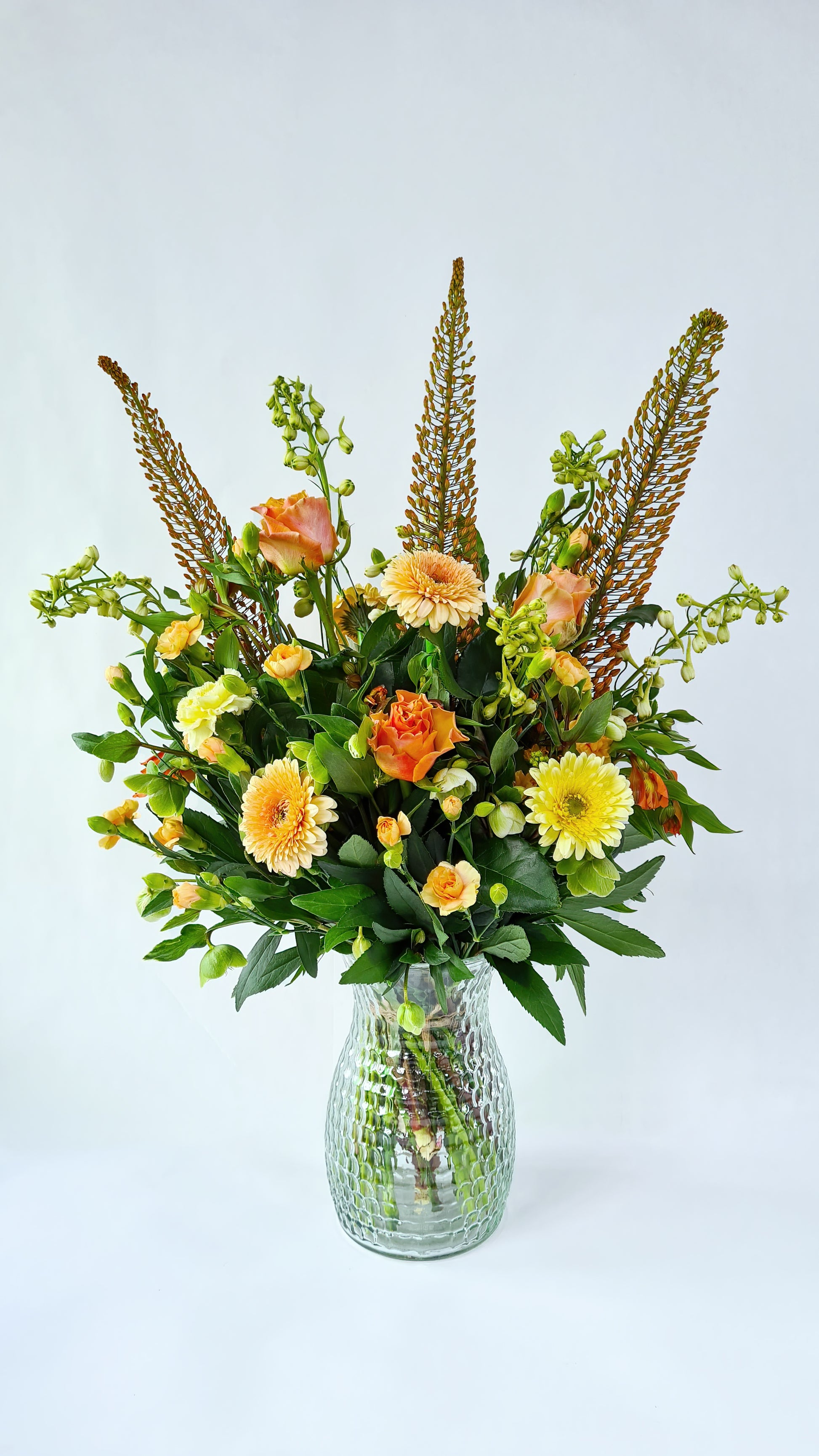 Pastel orange, yellow, and green bouquet.