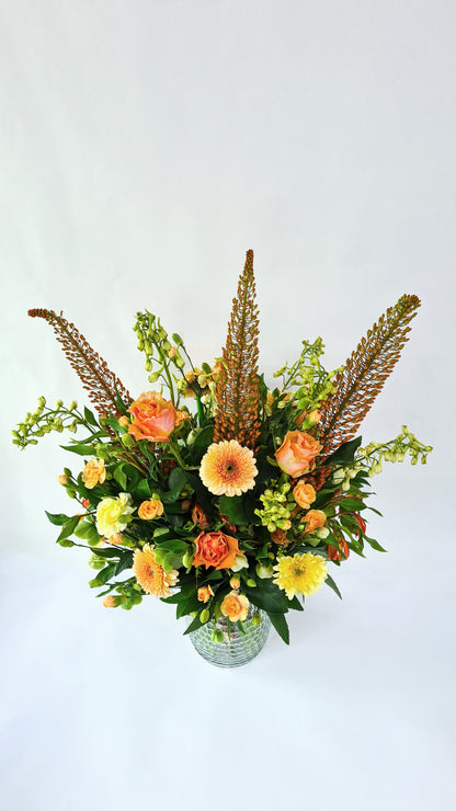 pastel orange, yellow, and green bouquet from above.